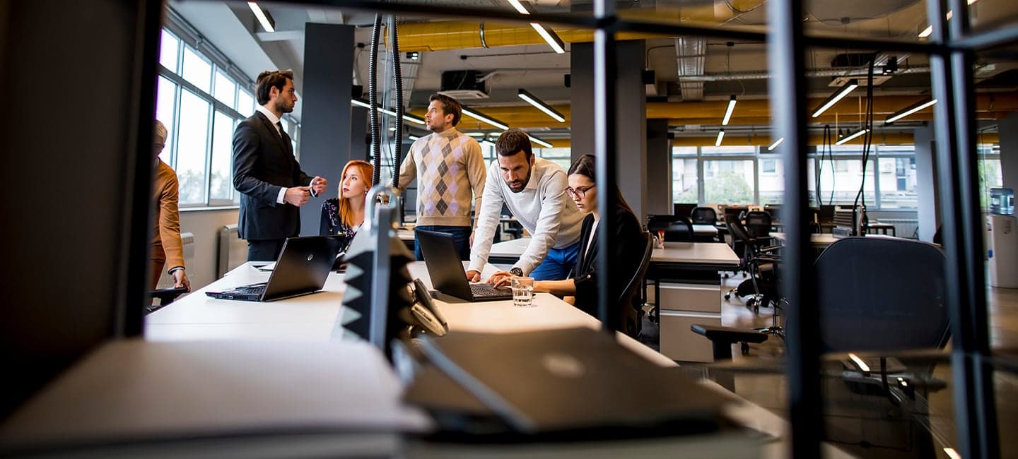 Team of IT professionals collaborating in a modern office